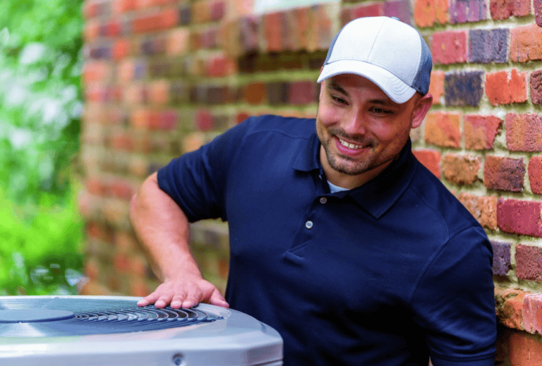 HVAC technician checking an outdoor air conditioning unit